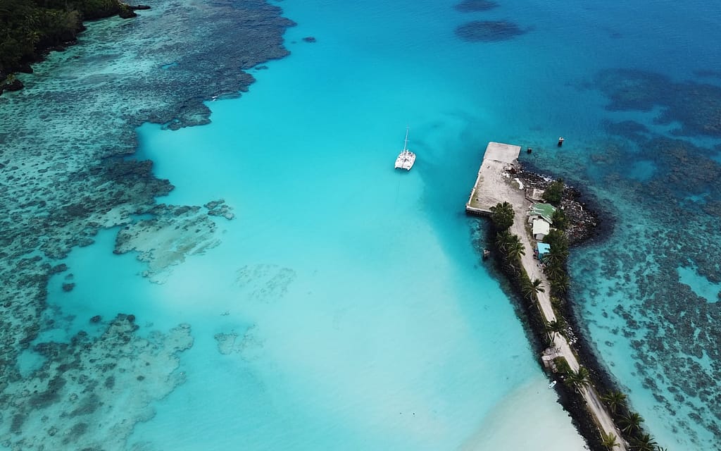 Bird's Eye View of a Fijian Islet and Catamaran